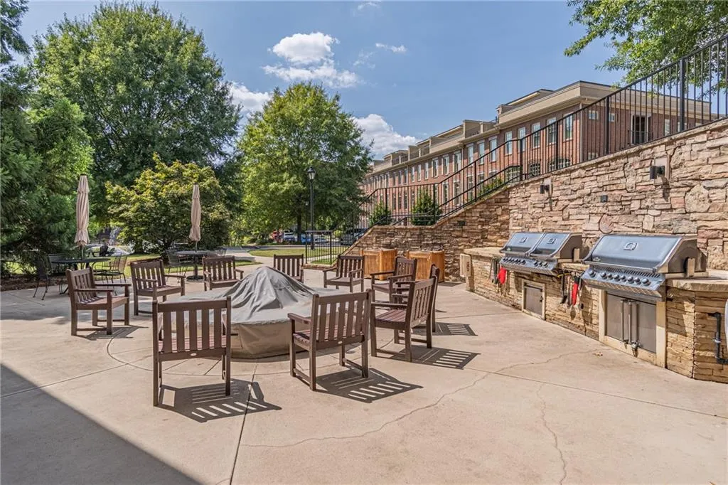 View of patio featuring a grill and an outdoor kitchen