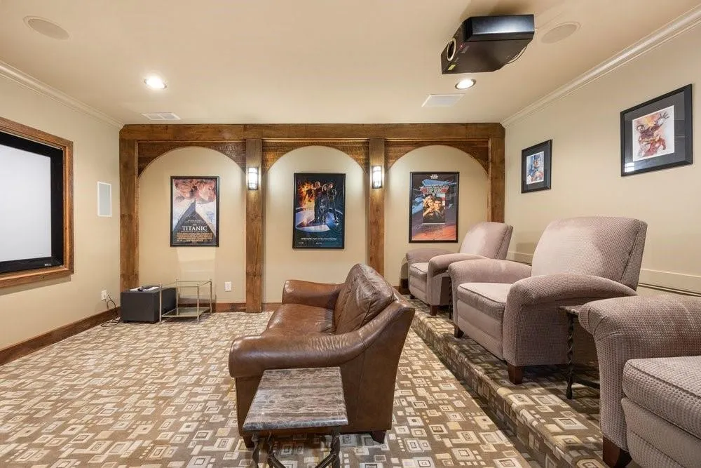 Home theater room with carpet flooring, crown molding, and recessed lighting