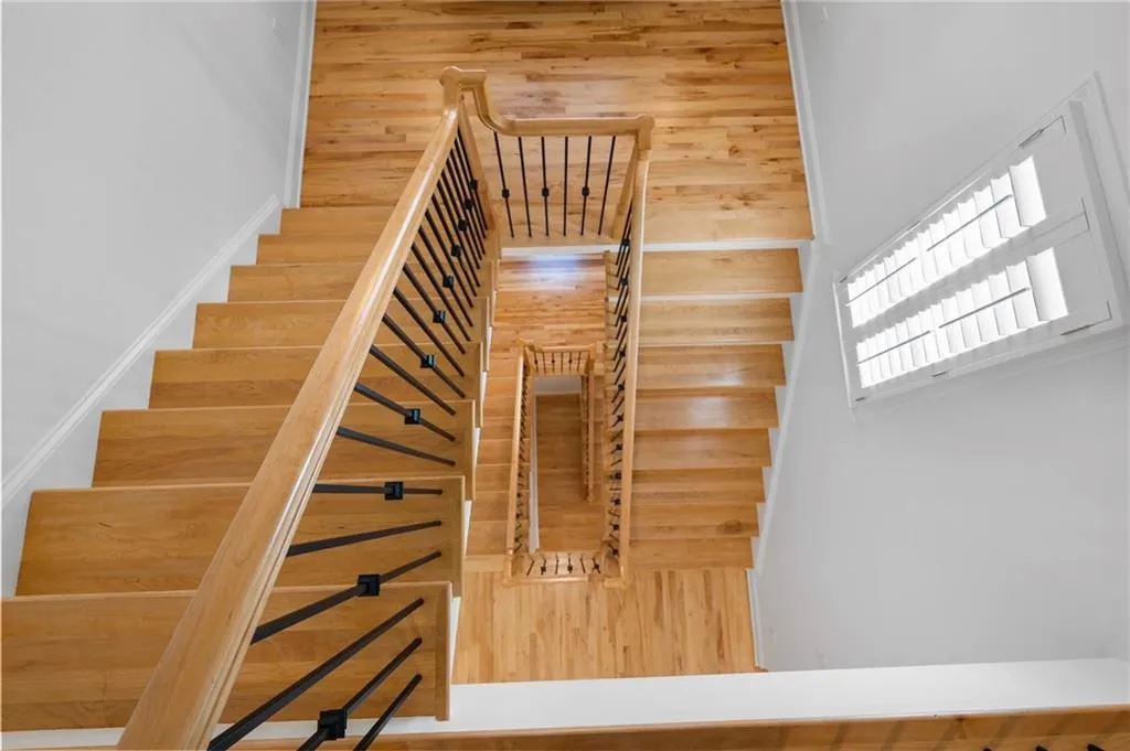 Stunning staircase - view from upper level all the way down to terrace level - Solid Maple hardwood!