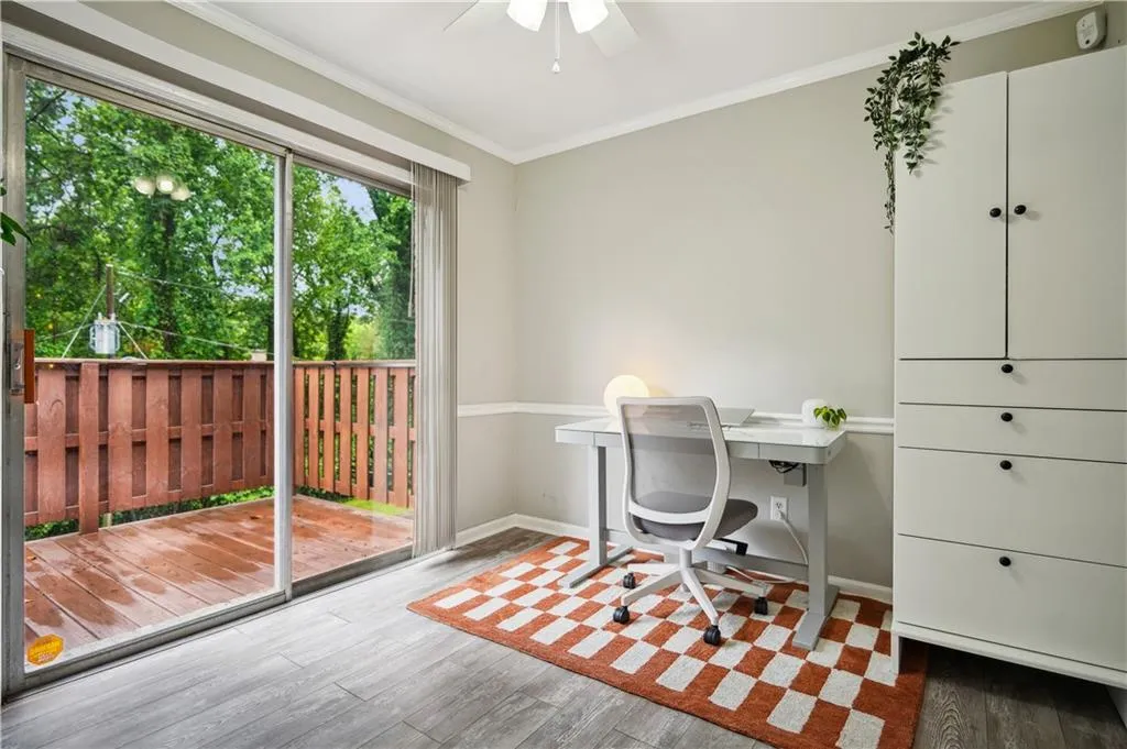 Office featuring wood-type flooring, ornamental molding, and ceiling fan