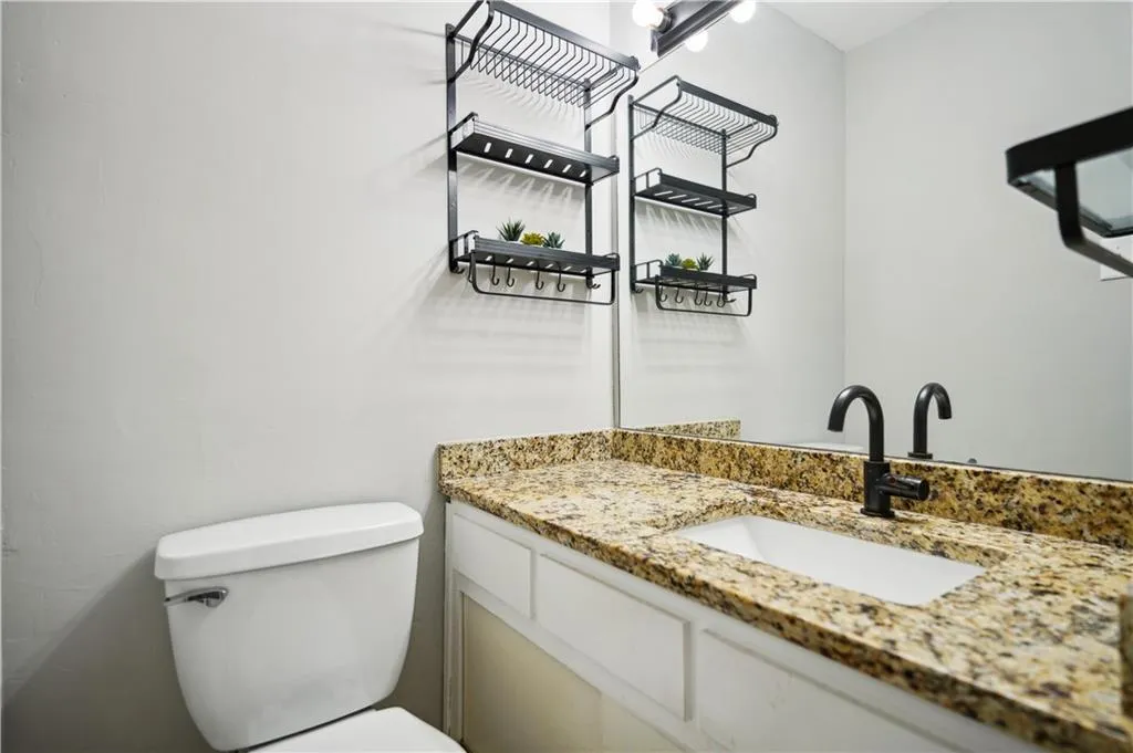 Bathroom with toilet and large vanity
