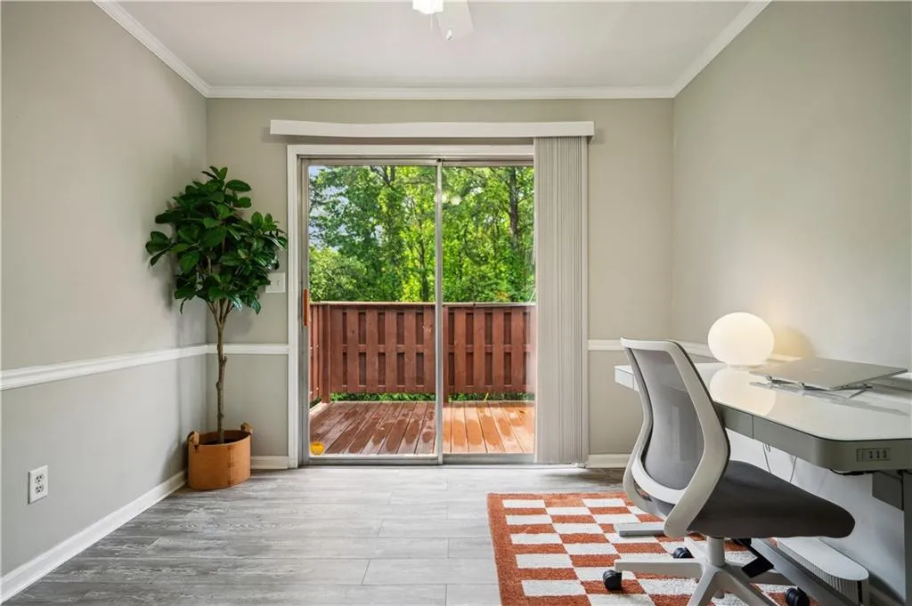 Office featuring ornamental molding and light wood-type flooring