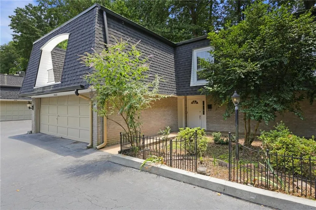 View of front of property featuring a garage