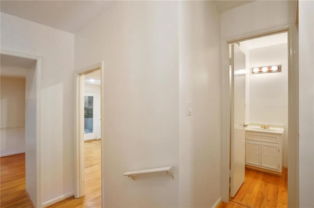 Foyer with view of powder room, kitchen and dining room