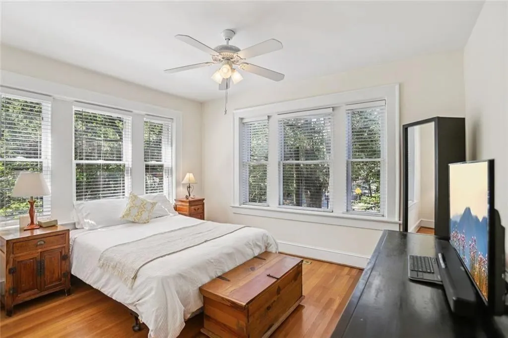 gorgeous corner bedroom with wooden blinds