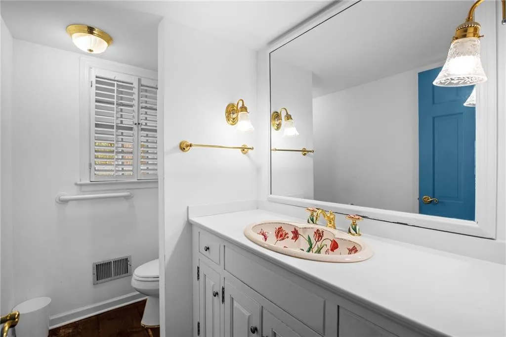 Bathroom with vanity and dark wood-type flooring