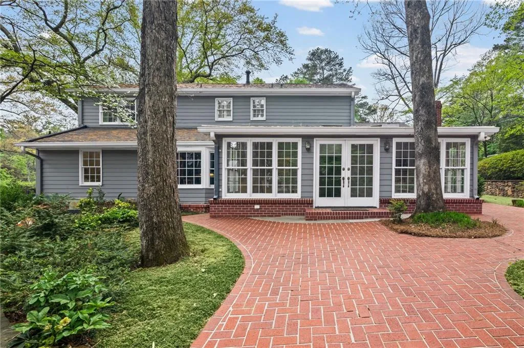 Rear view of house featuring french doors and a patio