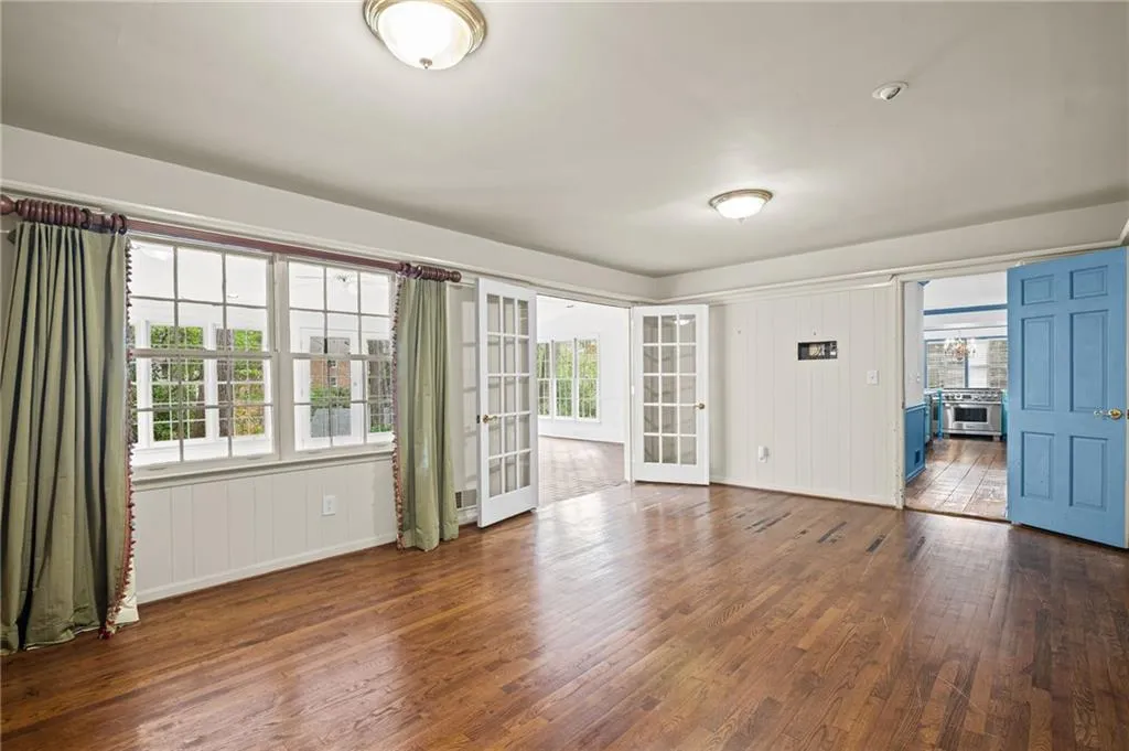 Entryway featuring dark wood finished floors and french doors