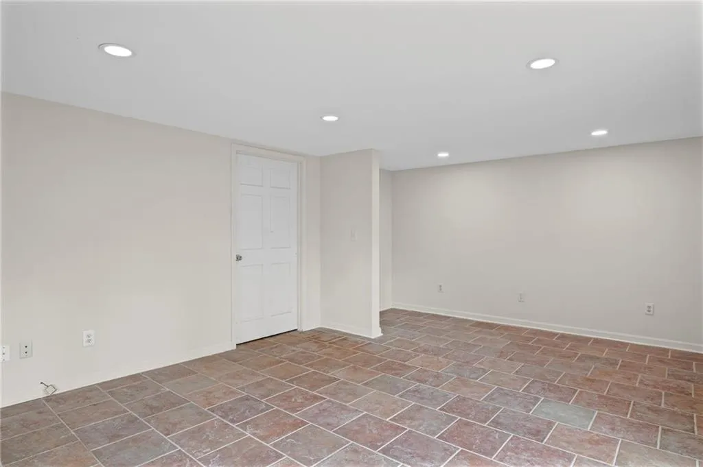 Spare room featuring recessed lighting and baseboards