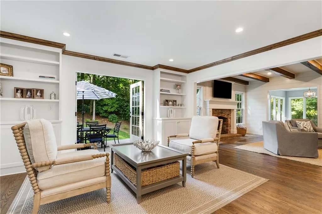 COFFEE LOUNGE | CUSTOM BUILT-IN STORAGE | VIEWS TO REAR YARD + GRILLING PATIO | CUSTOM CROWN MOLDING | STORAGE