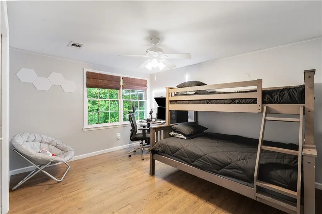 TERRACE LEVEL BEDROOM | CUSTOM WINDOW TREATMENTS | CLOSET | VIEWS TO REAR WOODED YARD