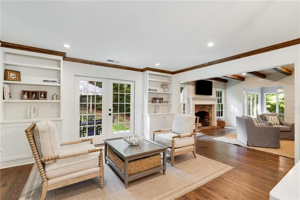 COFFEE LOUNGE VIEWS TO LIVING ROOM | NEUTRAL PAINT | HARDWOODS | STORAGE