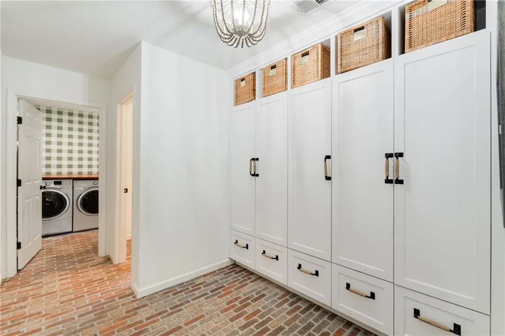 MUDROOM VIEW TO LAUNDRY + POWDER ROOMS | RECLAIMED BRICK FLOORING | CUSTOM LIGHTING | NEUTRAL PAINT