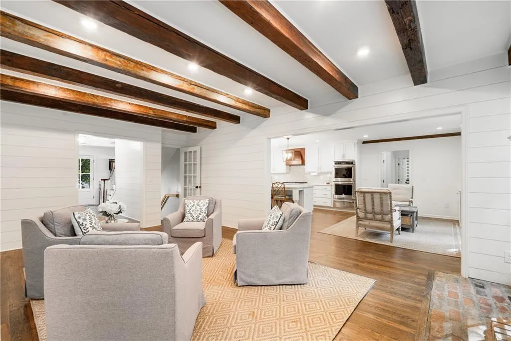 LIVING ROOM | RECLAIMED BRICK FIREPLACE HEARTH | VIEWS TO COFFEE LOUNGE + KITCHEN