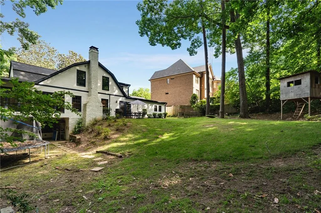REAR YARD VIEW TO TERRACE LEVEL COVERED PATIO | HYDRANGEA GARDEN | ROOM FOR POOL