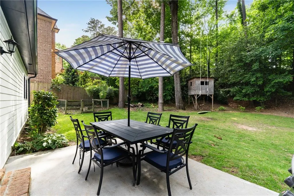 GRILLING PATIO VIEWS TO VEGETABLE GARDENS | WOODED HOMESITE | FENCED YARD