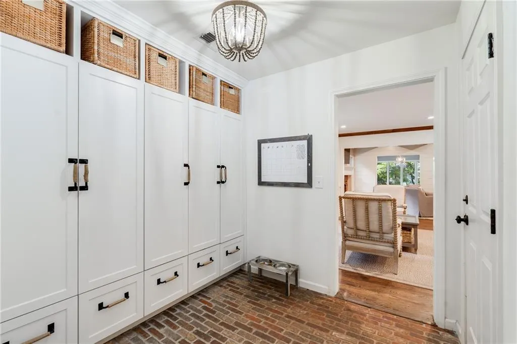 CUSTOM MUDROOM STORAGE | RECLAIMED BRICK FLOORING | VIEW TO COFFE ROOM | ENTRY TO GARAGE