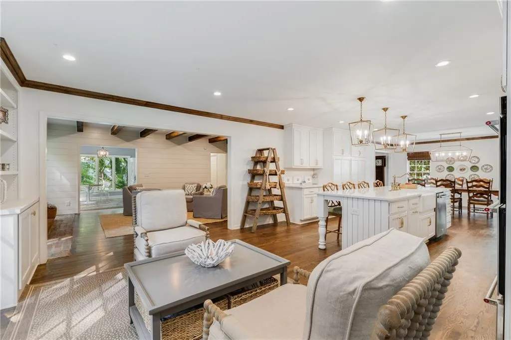 ALTERNATE KITCHEN VIEW | DINING ROOM + LIVING + GAMES ROOMS | HARDWOOD FLOORS | NEUTRAL PAINT | CUSTOM LIGHTING