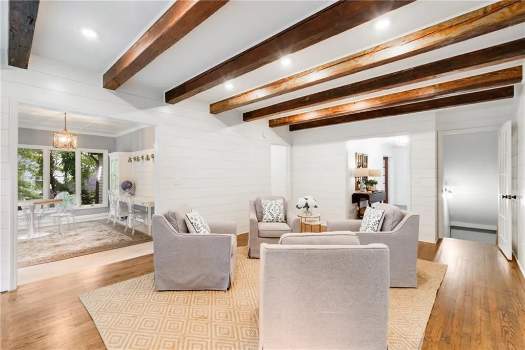 THOUGHTFUL RECESSED LIGHTING | LIVING ROOM VIEWS TO GAMES ROOM, FOYER + TERRACE LEVEL | CUSTOM RECLAIMED BEAMS