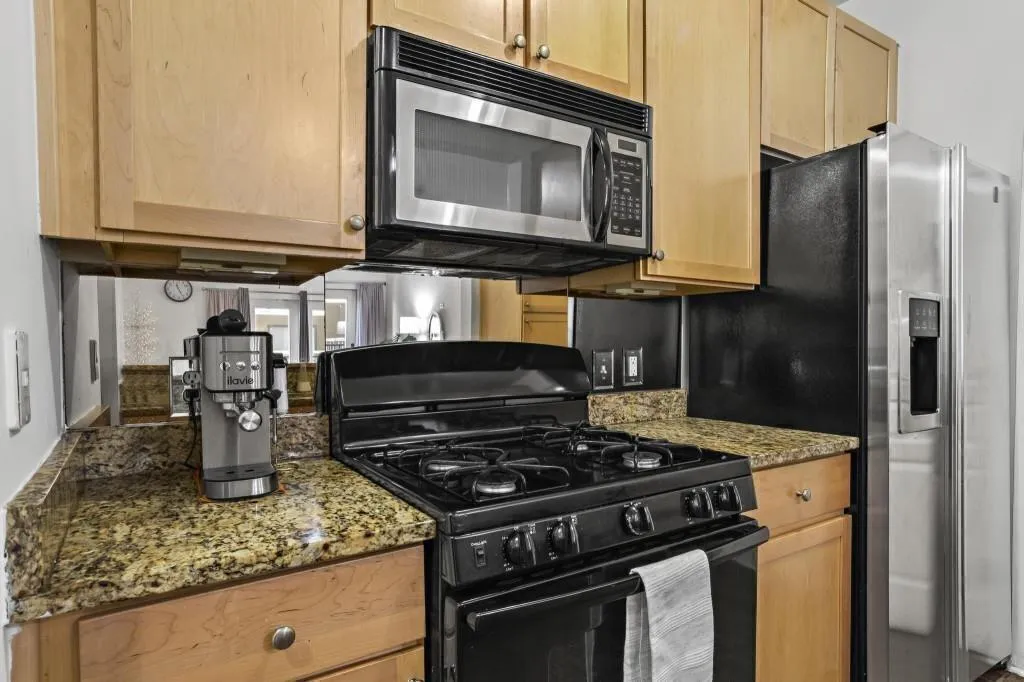Kitchen featuring gas stove and stainless applianc