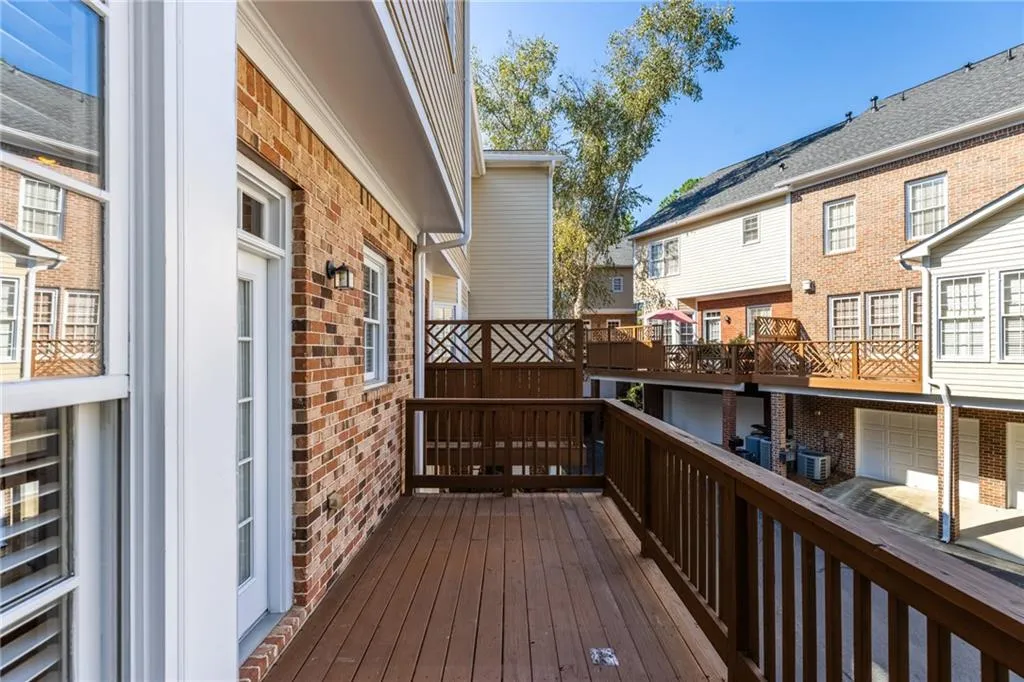 Wooden deck with a residential view