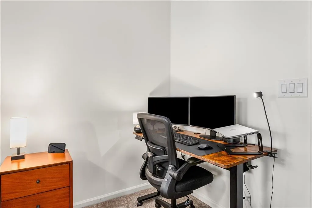 Office area featuring baseboards
