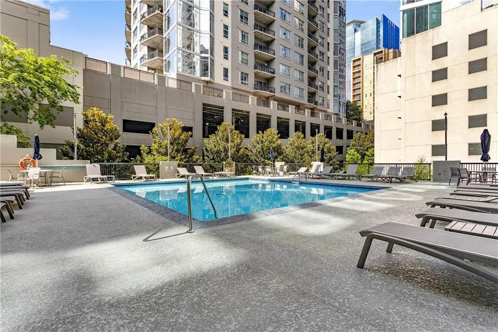 Community pool featuring a patio area