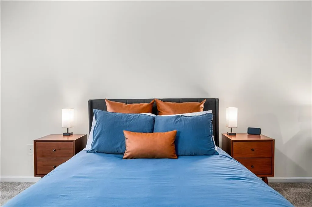 Bedroom with light carpet