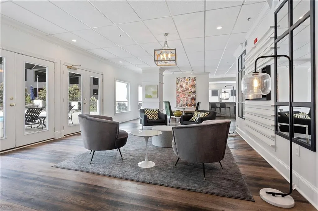 Lobby featuring ornamental molding, recessed lighting, and a paneled ceiling