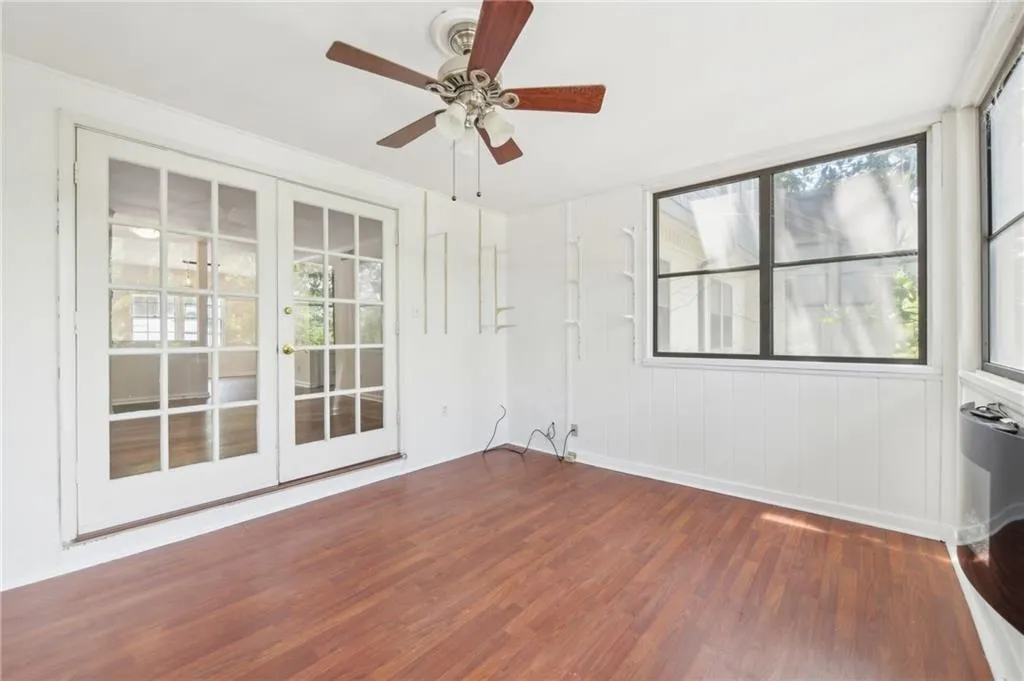 Spare room featuring wood finished floors and ceiling fan
