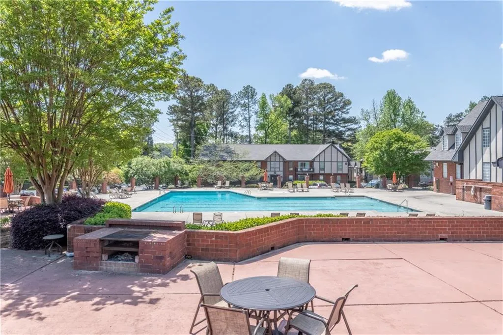 Community pool featuring a patio