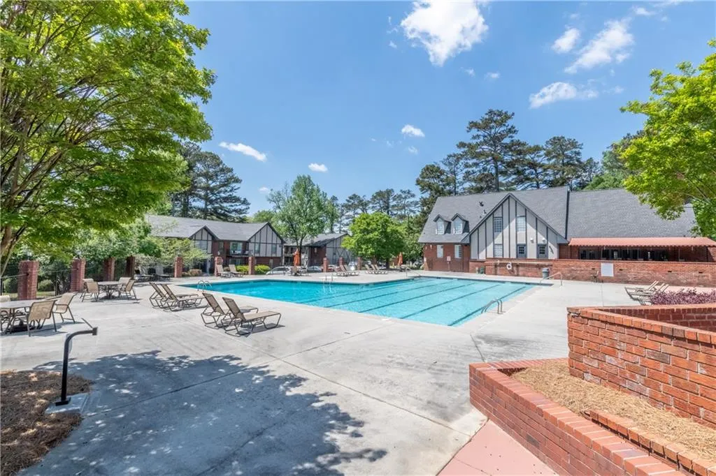 Community pool featuring a patio area