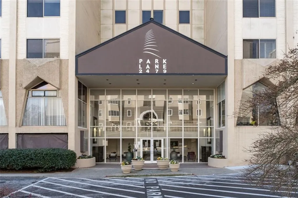 View of exterior entry with uncovered parking