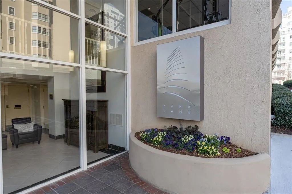 Entrance to property with stucco siding