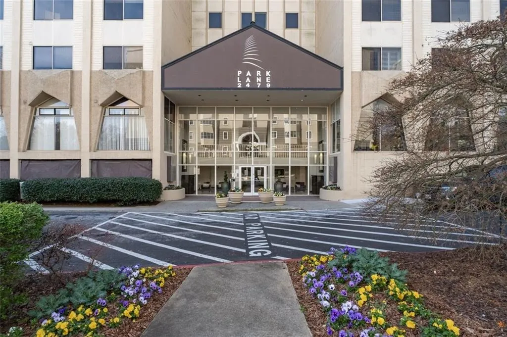 Property entrance featuring uncovered parking