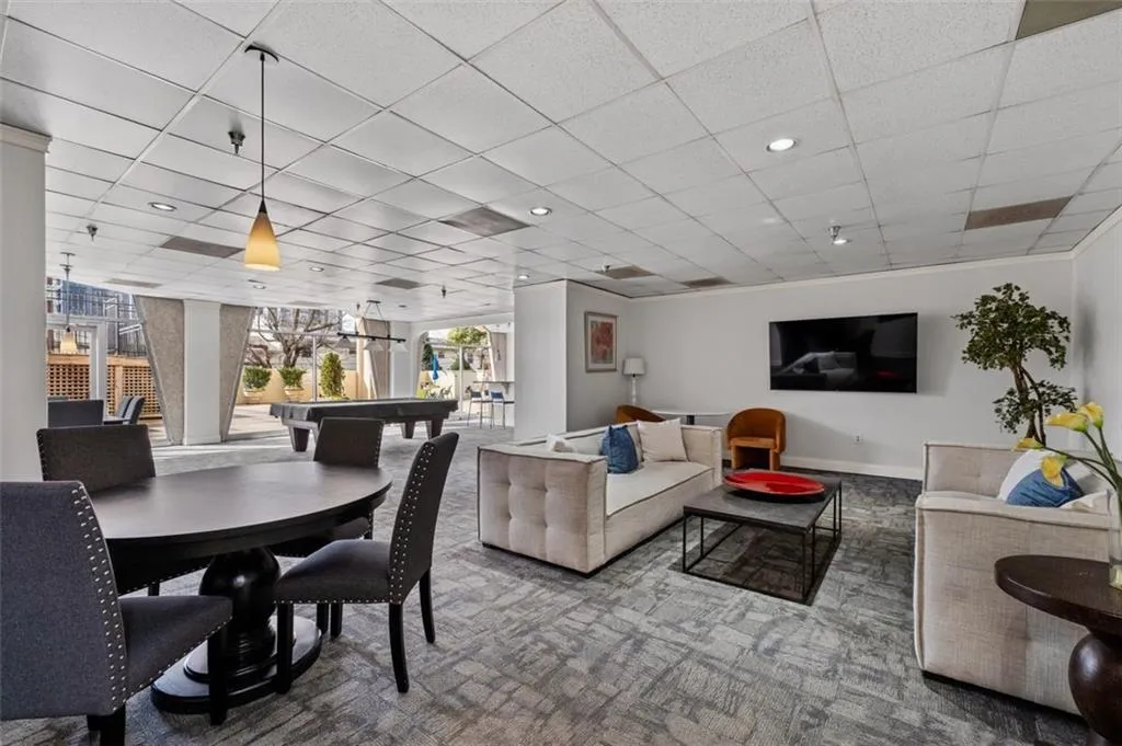 Living room with billiards, recessed lighting, baseboards, carpet flooring, and a paneled ceiling