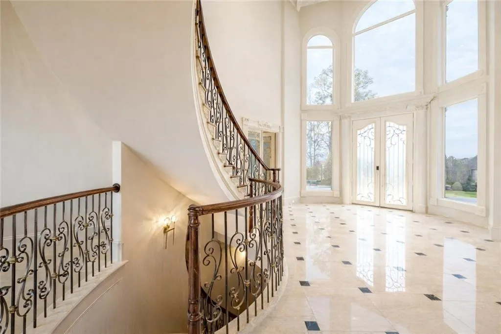 Entryway featuring french doors and a towering ceiling