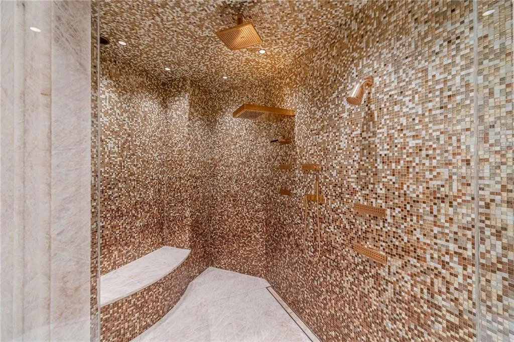 Bathroom featuring a tile shower