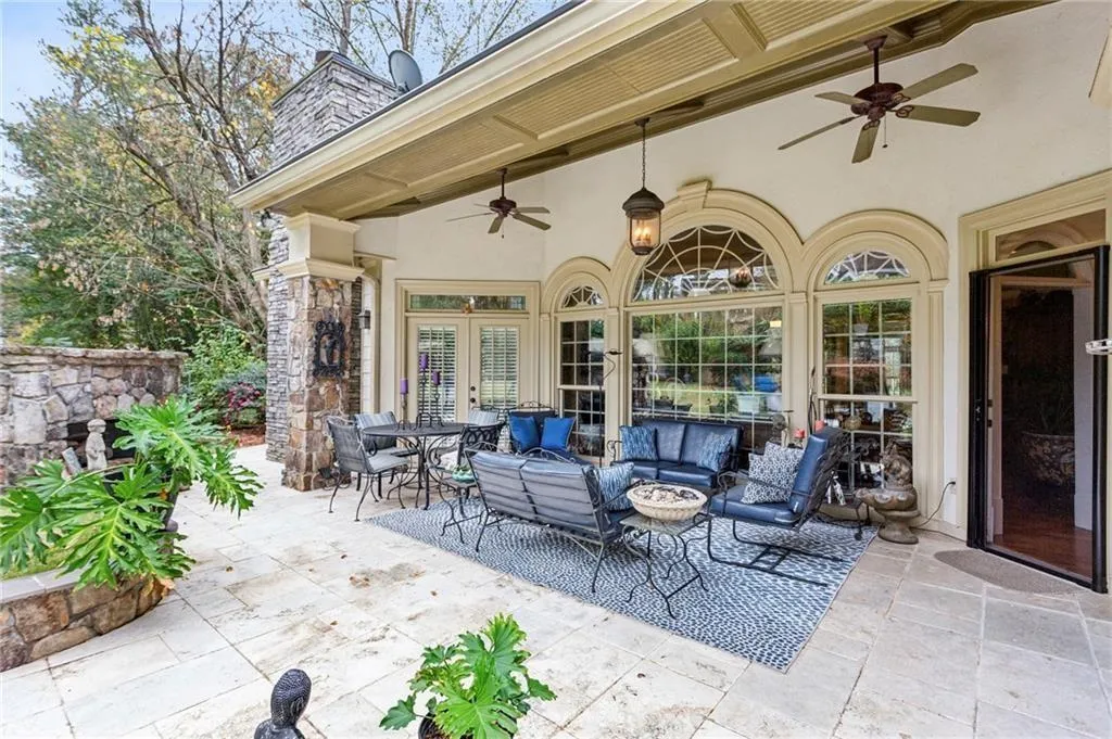 View of patio with french doors, ceiling fan, an outdoor hangout area, and outdoor dining area