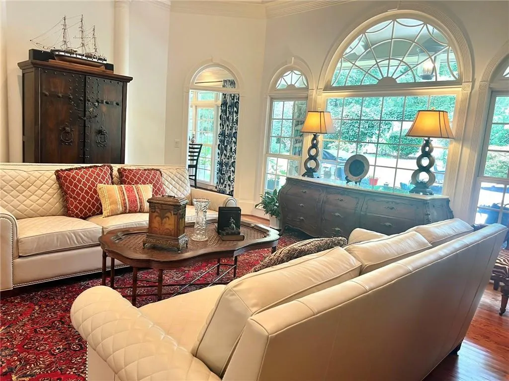 Living room featuring crown molding and wood finished floors