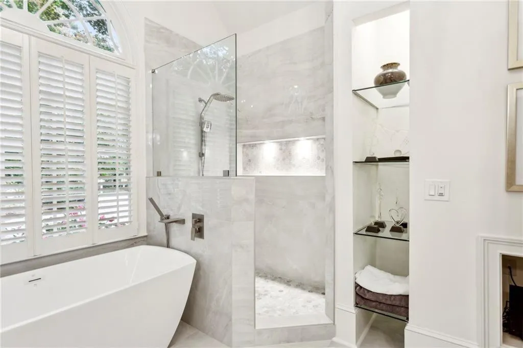Bathroom with walk in shower and a freestanding tub