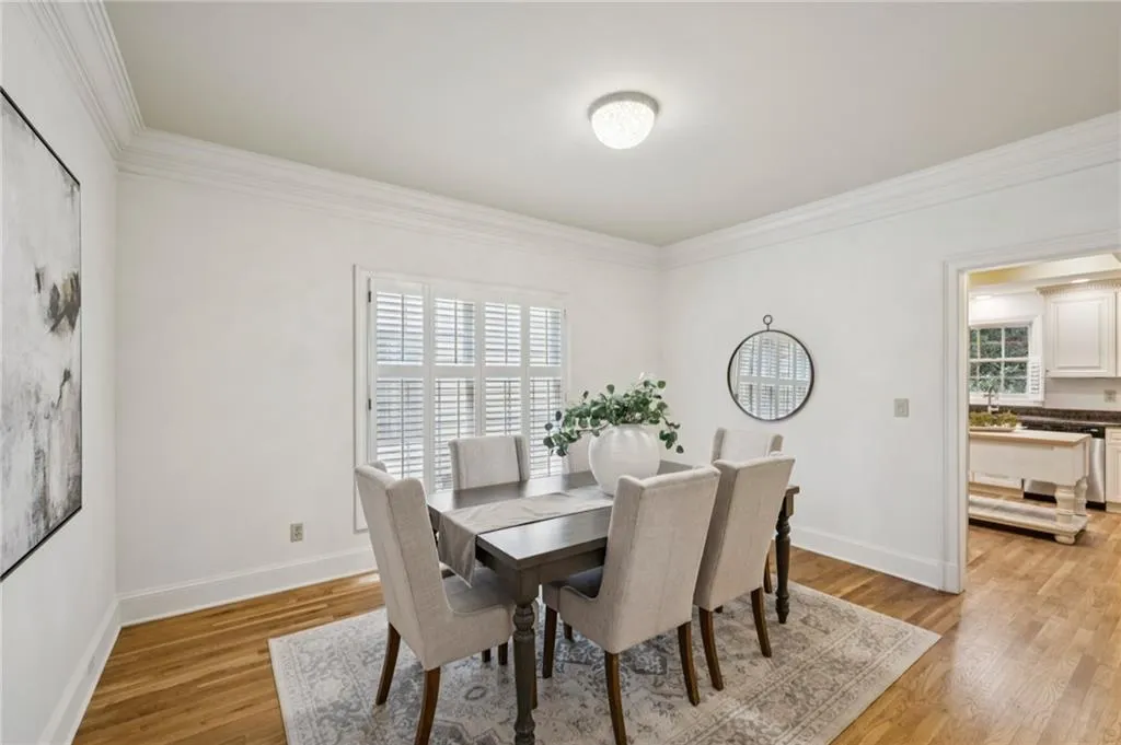Dining room featuring crown molding and light wood finished floors