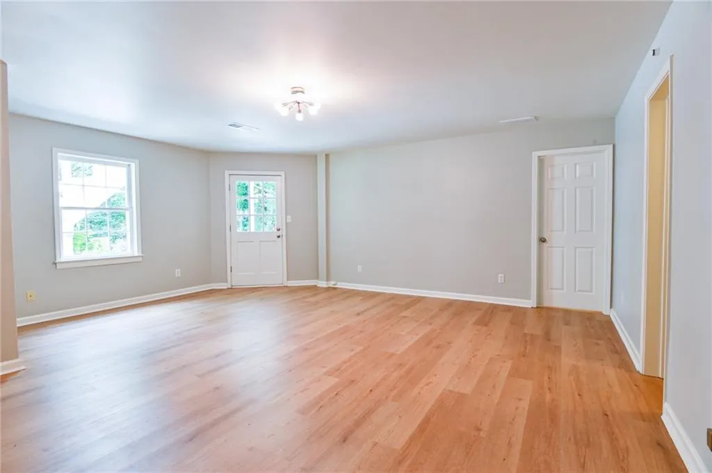 Unfurnished room with light hardwood / wood-style floors