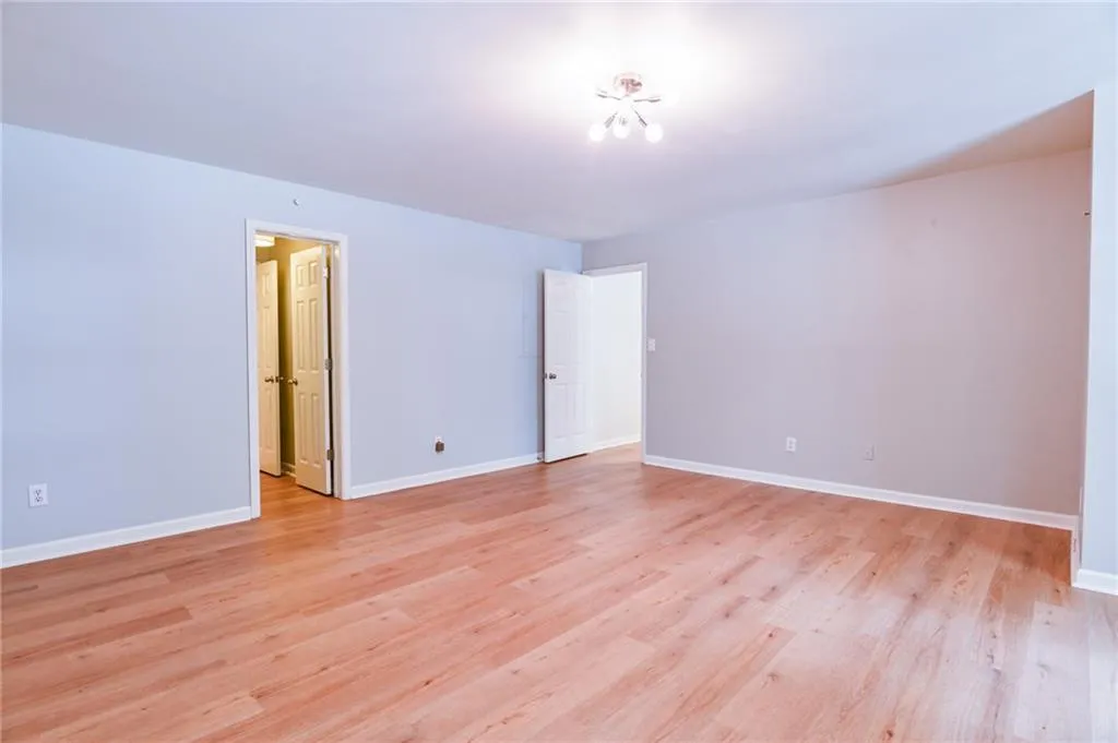 Spare room featuring light wood-type flooring