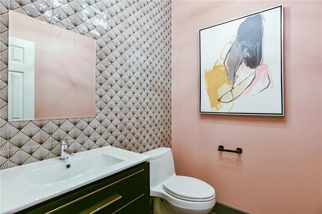 Bathroom featuring vanity and toilet