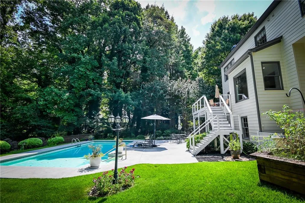 View of pool with a yard and a patio