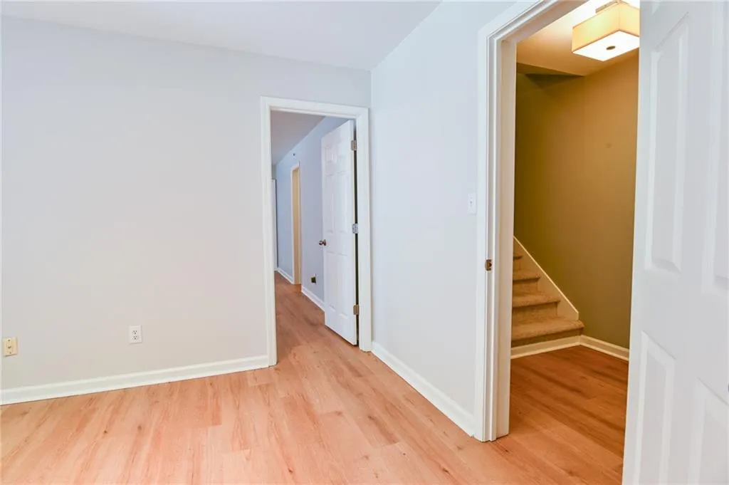 Hallway featuring light wood-type flooring