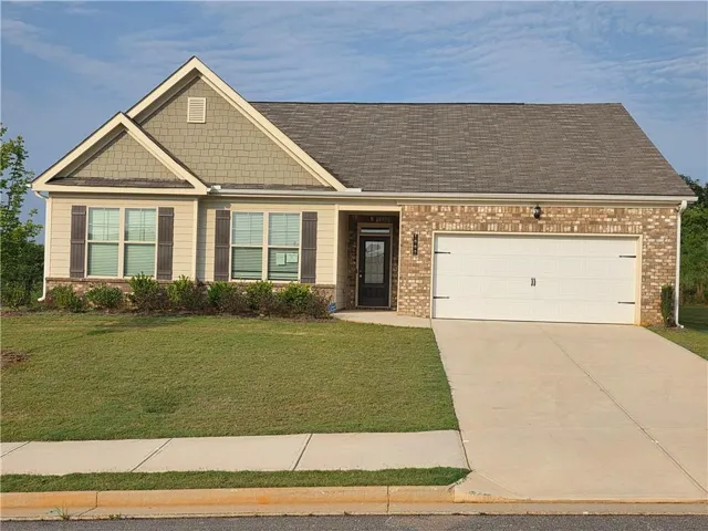 Brick and siding exterior with decorative gables