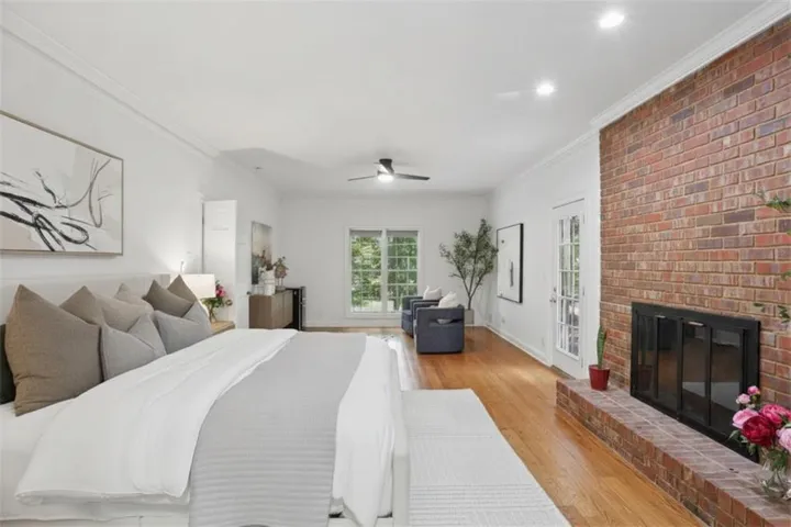 Over-sized master on main with stunning gas fireplace and seating area and walkout deck perfect for morning coffee
