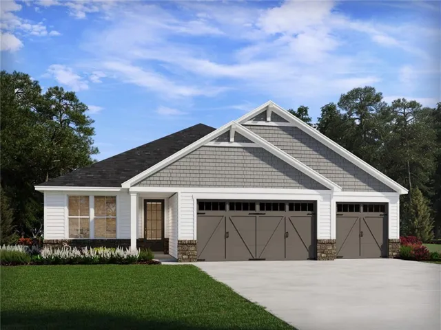 Modern single-story residence featuring a clean contemporary design with a gabled roofline and stone accent pillars
